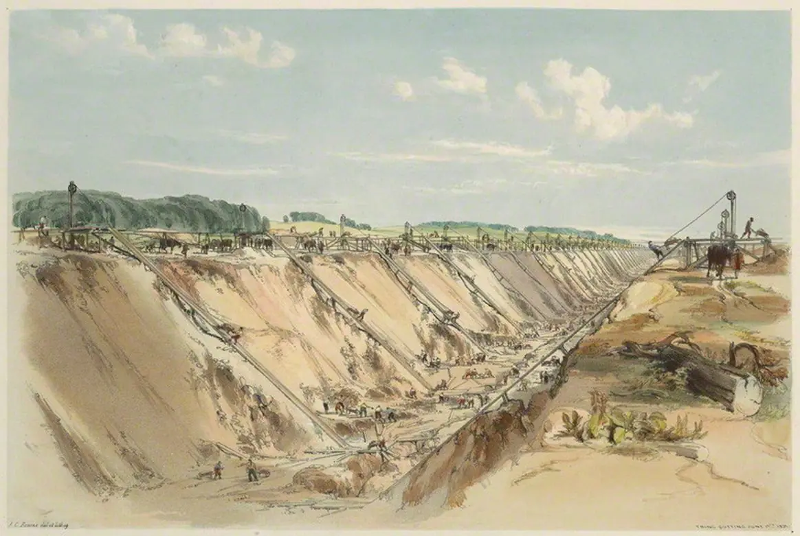 A vast cutting gouged through chalk hills, its sloped walls lined with barrow runs and tiny figures of labourers.